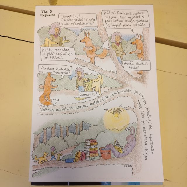 paperille piirretty sarjakuva sivu pöydällä